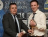 Antrim Chairman Collie Donnelly presents Ciaran McGuckin with the Junior Feis Trophy on behalf of the Reserve team.